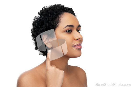 Image of african american woman showing her ear