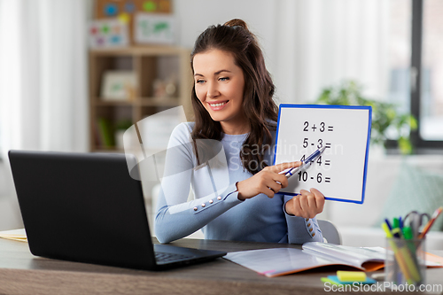 Image of math teacher having online class at home