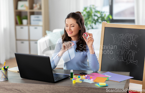 Image of teacher having online class of arts and crafts