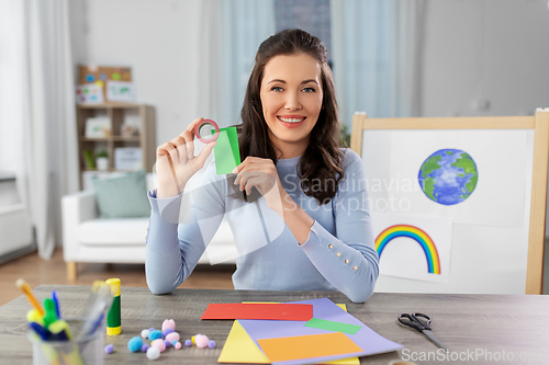 Image of teacher having online class of arts and crafts