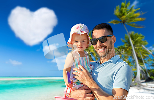 Image of happy father with little daughter on beach