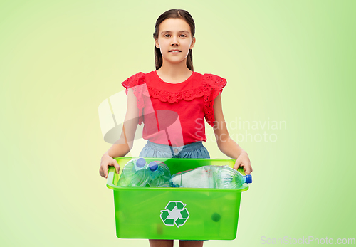 Image of smiling girl sorting plastic waste over green