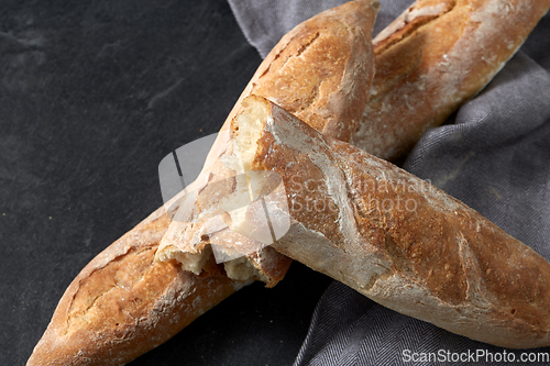 Image of close up of baguette bread on kitchen towel