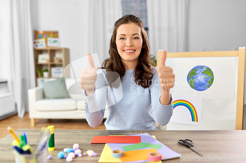 Image of teacher having online class of arts and crafts