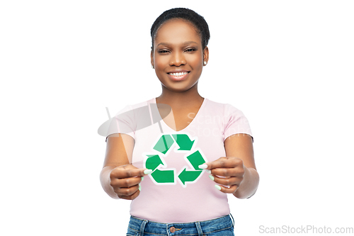 Image of smiling asian woman holding green recycling sign