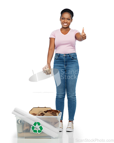 Image of happy african american woman sorting paper waste