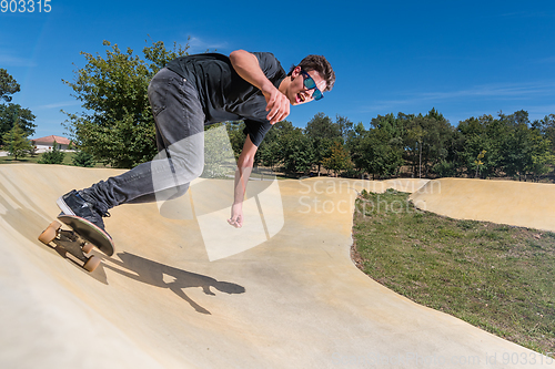 Image of Skateboarder on a pump track park
