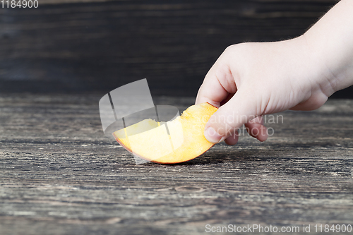 Image of one cut fresh soft peach