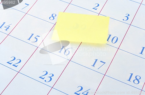 Image of Yellow memo note on a calendar