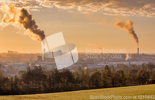 Image of industrial cityscape with with smoking factory