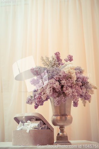 Image of Lilac bouquet in a silver vase