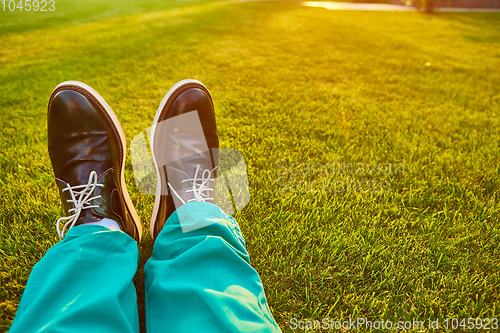 Image of Man relaxing, enjoying landscape on sunny day - point of view