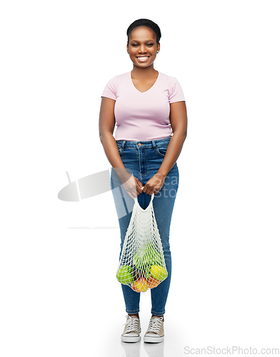 Image of african woman with food in reusable string bag