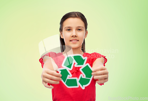 Image of smiling girl holding green recycling sign