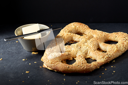 Image of close up of cheese bread, butter and table knife