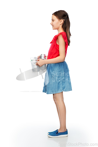 Image of smiling girl sorting metallic waste