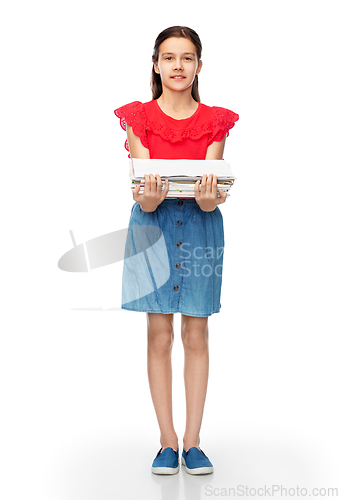 Image of smiling girl with magazines sorting paper waste