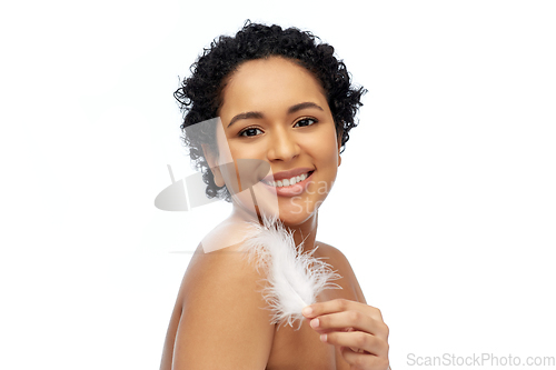 Image of happy african american woman with feather