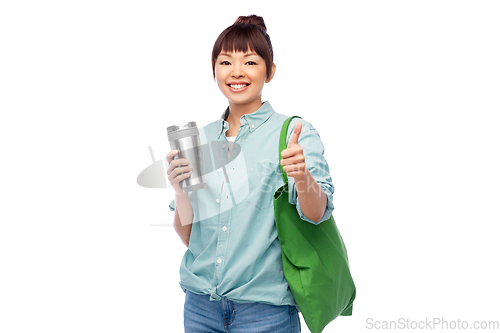 Image of woman with tumbler and reusable food shopping bag