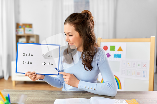 Image of math teacher having online class at home