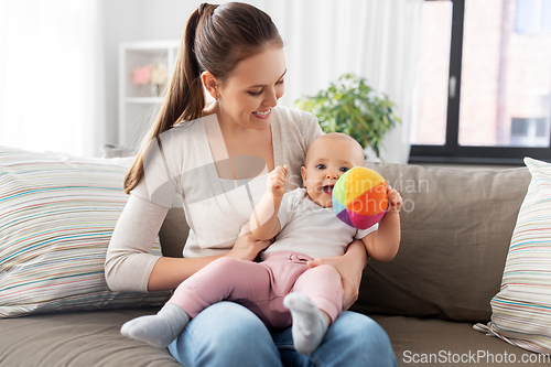 Image of happy smiling mother with little baby at home