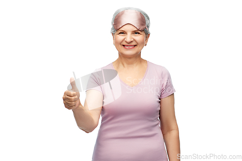 Image of senior woman in pajamas and eye sleeping mask