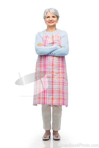 Image of portrait of smiling senior woman in apron