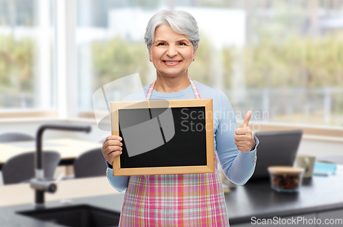 Image of old woman in apron with menu showing thumbs up