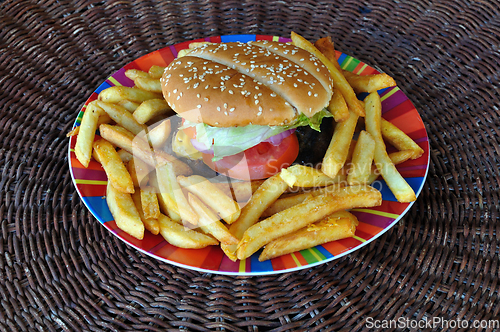 Image of beef cheeseburger and french fries