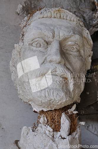 Image of broken statue head ancient god