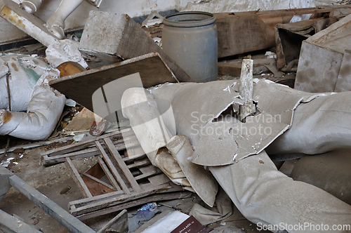 Image of broken statues in vandalized interior