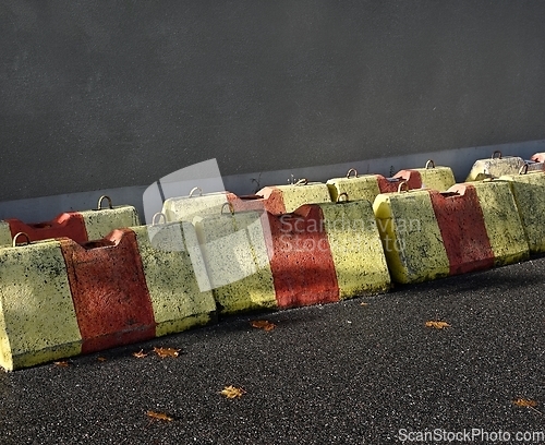 Image of road concrete blocks and barriers on the asphalt