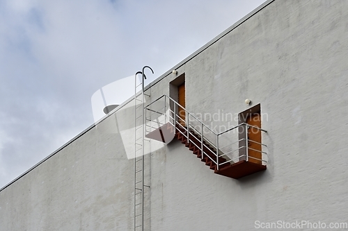 Image of wall of the house with a staircase and doors