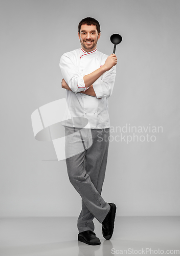 Image of happy smiling male chef in jacket with ladle
