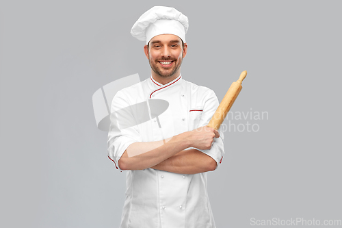 Image of happy smiling male chef or baker with rolling pin