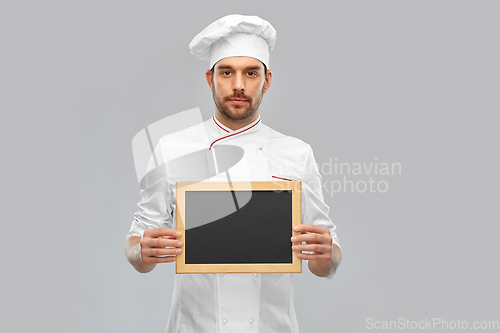 Image of male chef showing chalkboard