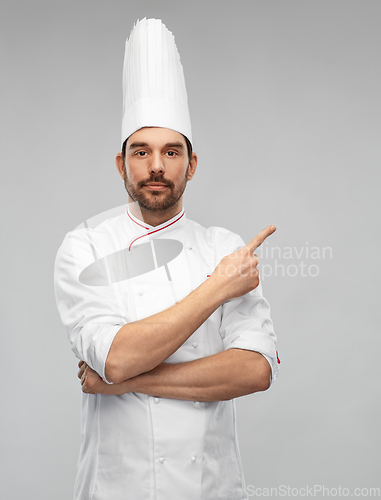 Image of male chef in toque pointing finger