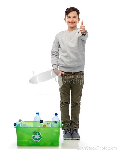 Image of smiling boy sorting plastic waste