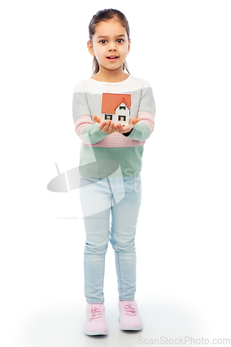 Image of smiling girl holding house model