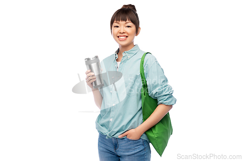 Image of woman with tumbler and reusable food shopping bag