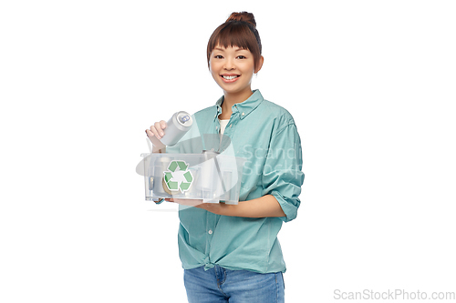 Image of smiling young asian woman sorting metallic waste