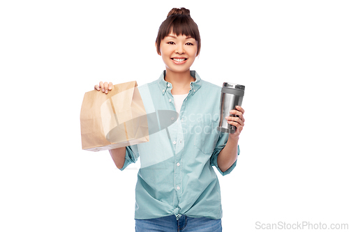 Image of woman with thermo cup or tumbler for hot drinks