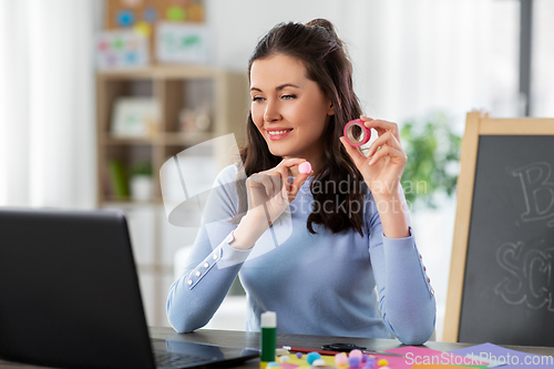 Image of teacher having online class of arts and crafts