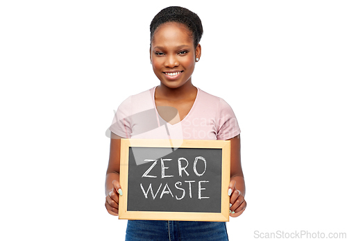 Image of happy woman holds chalkboard with zero waste words