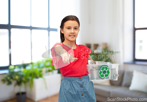 Image of smiling girl sorting metallic waste at home