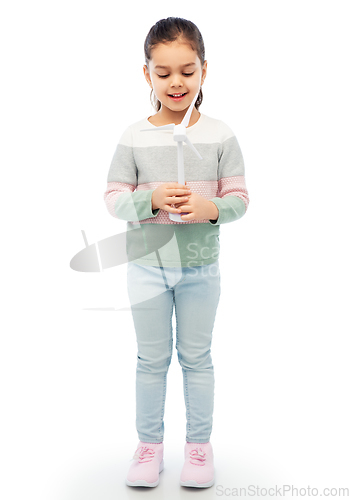 Image of smiling girl with toy wind turbine