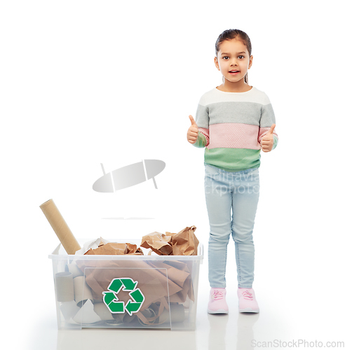 Image of girl sorting paper waste and showing thumbs up