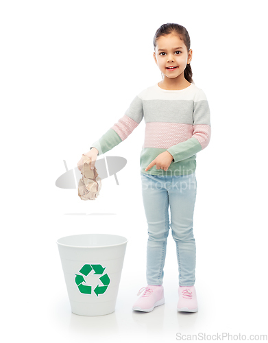 Image of girl throwing paper waste into rubbish bin