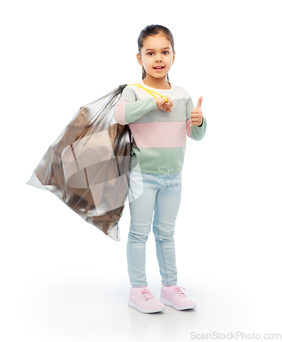 Image of smiling girl with paper garbage in plastic bag