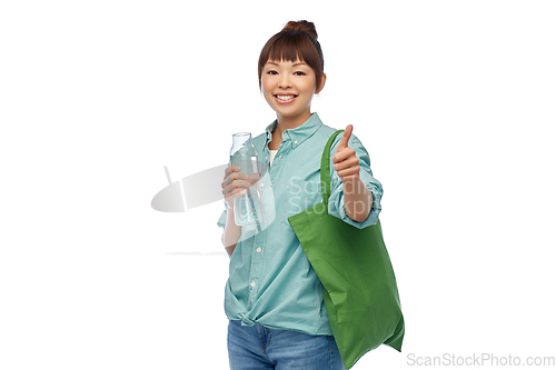 Image of woman with bag for food shopping and glass bottle